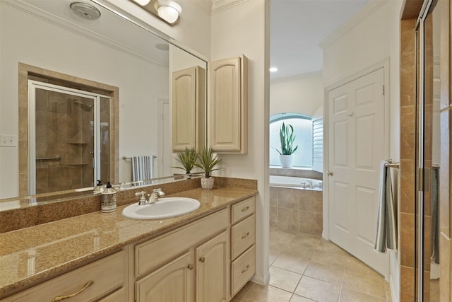 bathroom featuring tile patterned flooring, vanity, independent shower and bath, and crown molding