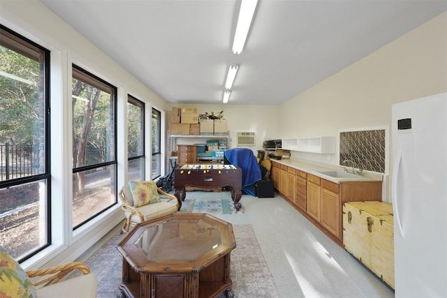 interior space with sink and a wall mounted AC