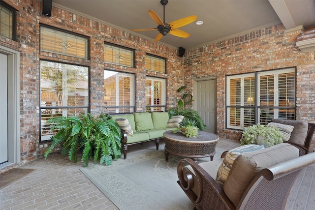 sunroom / solarium with ceiling fan