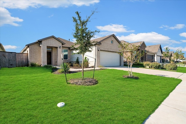 view of front of house featuring a garage and a front lawn