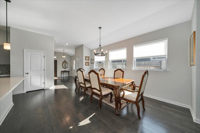 dining space with a chandelier, dark hardwood / wood-style flooring, and vaulted ceiling