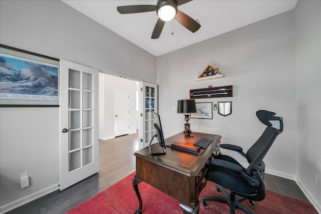 office featuring ceiling fan, vaulted ceiling, dark wood-type flooring, and french doors