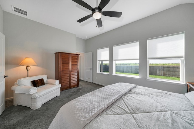 carpeted bedroom featuring ceiling fan and lofted ceiling