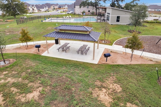 view of property's community featuring a lawn, a gazebo, and a pool