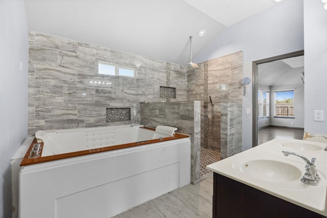 bathroom featuring vanity, hardwood / wood-style flooring, separate shower and tub, and lofted ceiling