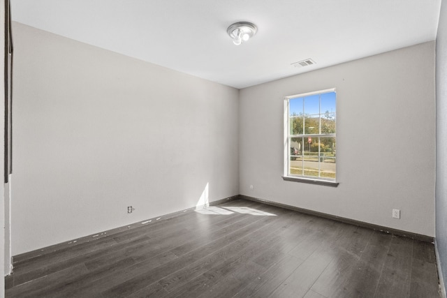 empty room featuring dark hardwood / wood-style floors