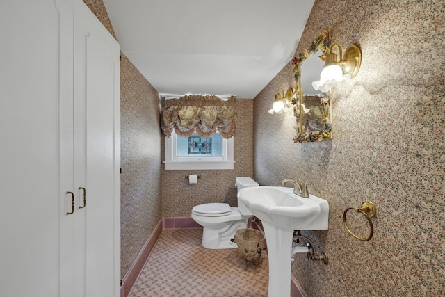 bathroom featuring sink and toilet