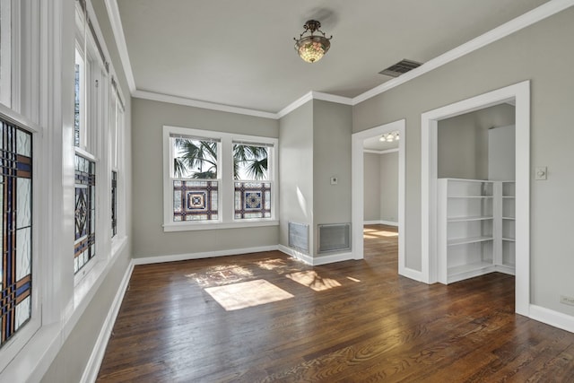 unfurnished room with dark hardwood / wood-style flooring and ornamental molding