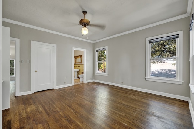 unfurnished bedroom with ceiling fan, dark hardwood / wood-style floors, and multiple windows