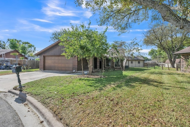 view of front of house with a garage and a front yard