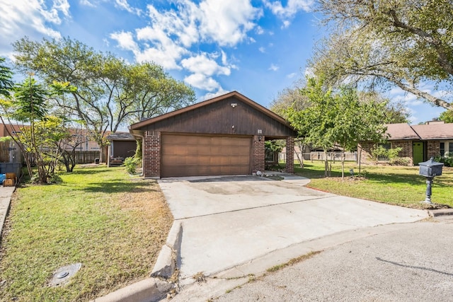 ranch-style house featuring a garage and a front lawn