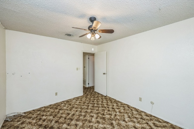 unfurnished room featuring carpet flooring, ceiling fan, and a textured ceiling