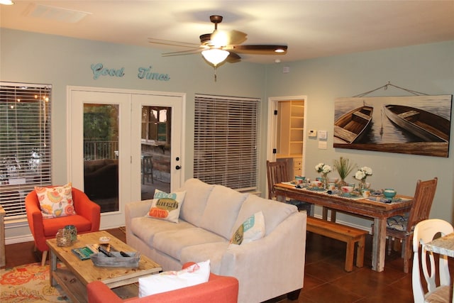 tiled living room with ceiling fan