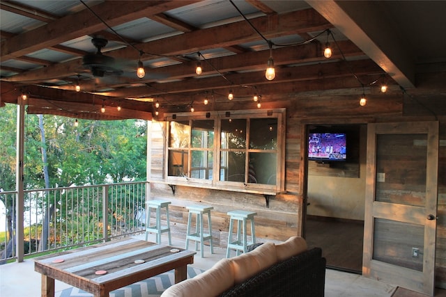 view of patio / terrace featuring outdoor lounge area, ceiling fan, and an outdoor bar