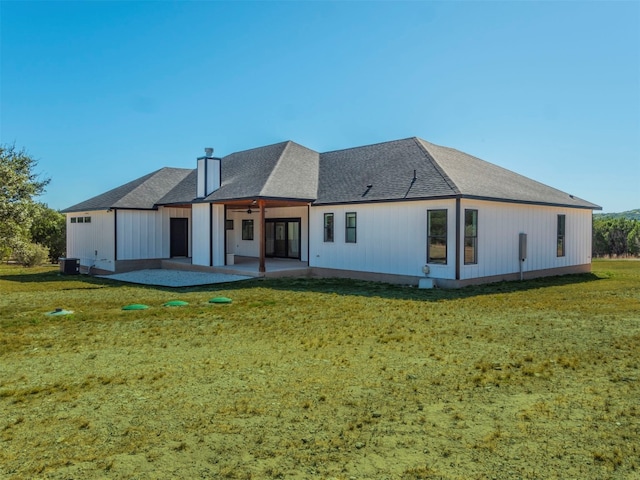 rear view of house with a yard, a patio, and ceiling fan