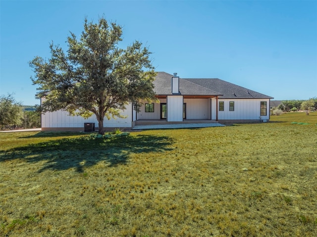 back of house featuring a yard, a patio, and cooling unit