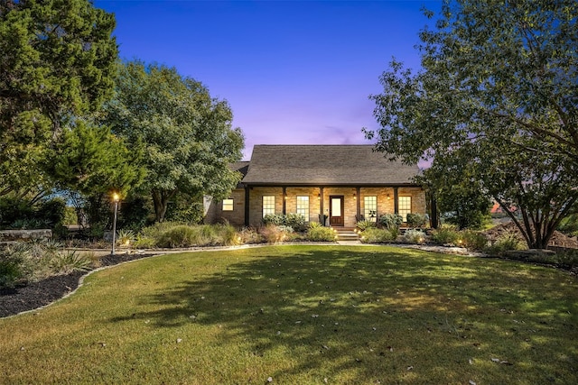 view of front of home with a lawn