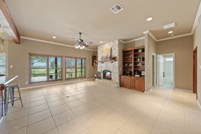 unfurnished living room featuring ceiling fan, a stone fireplace, light tile patterned floors, and crown molding