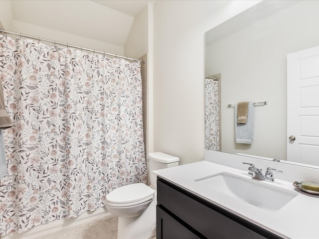 bathroom featuring tile patterned flooring, vanity, and toilet