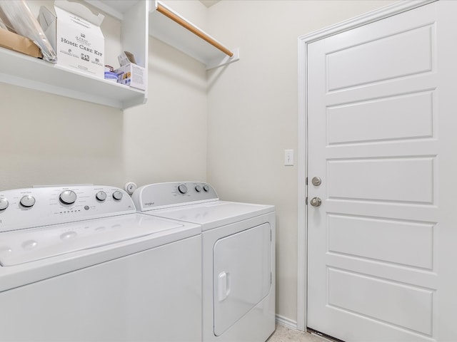 laundry area featuring washing machine and clothes dryer