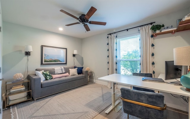 office area with hardwood / wood-style flooring and ceiling fan