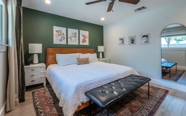 bedroom with light wood-type flooring and ceiling fan