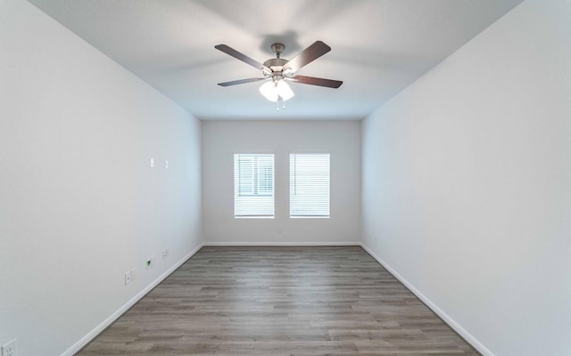 empty room featuring ceiling fan and wood-type flooring