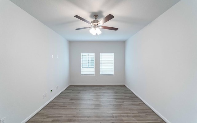 721 Barbary Coast Ln, Jarrell, TX 76537 - spare room featuring wood finished floors, baseboards, and ceiling fan