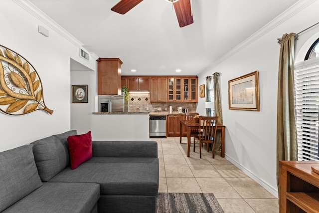 tiled living room with crown molding and ceiling fan