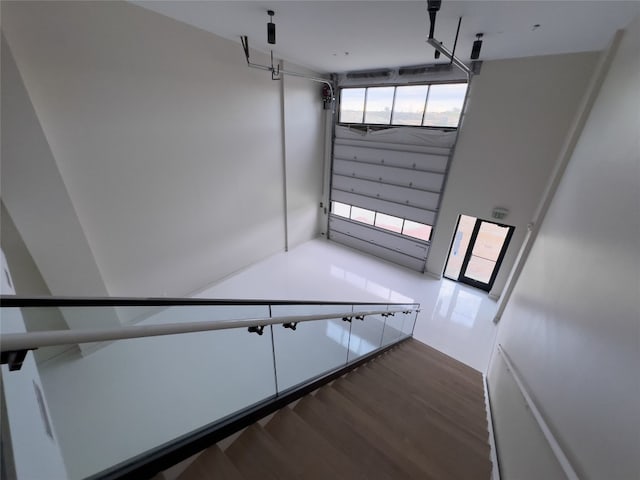 staircase featuring hardwood / wood-style flooring