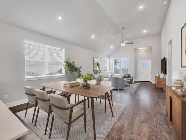 dining space with dark hardwood / wood-style floors, ceiling fan, and lofted ceiling