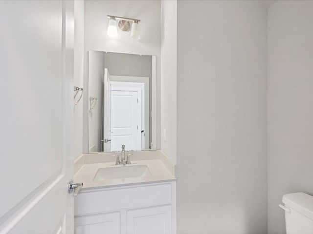 bathroom with vanity and toilet