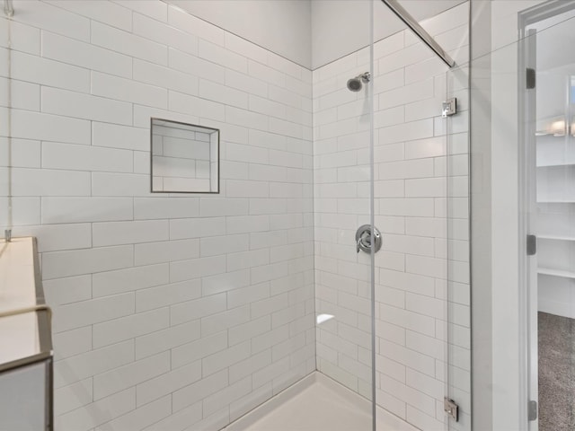 bathroom with tiled shower