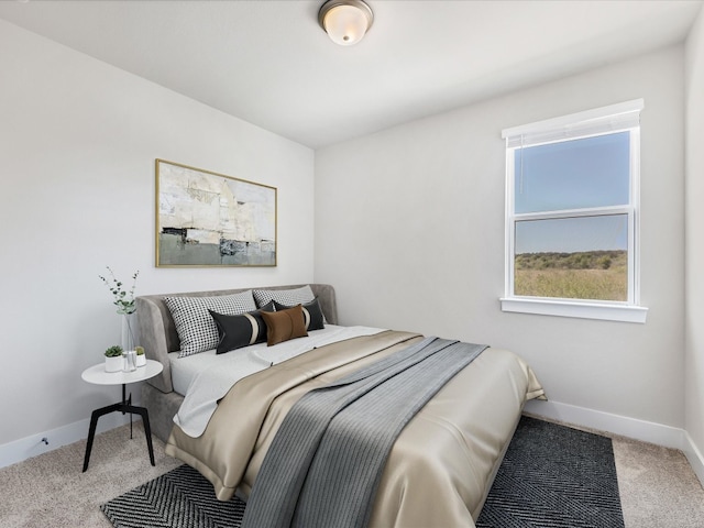 bedroom with light carpet