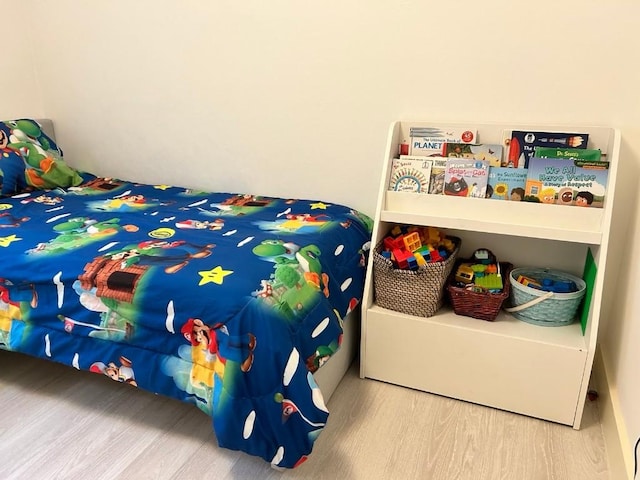 bedroom featuring wood-type flooring