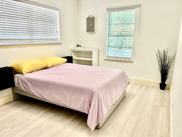 bedroom featuring light wood-type flooring