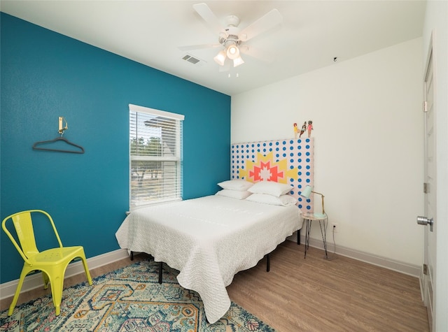 bedroom featuring ceiling fan and hardwood / wood-style floors