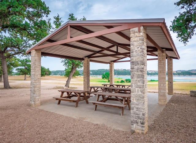 surrounding community featuring a gazebo and a water view