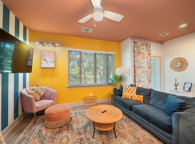 living room with ceiling fan and wood-type flooring