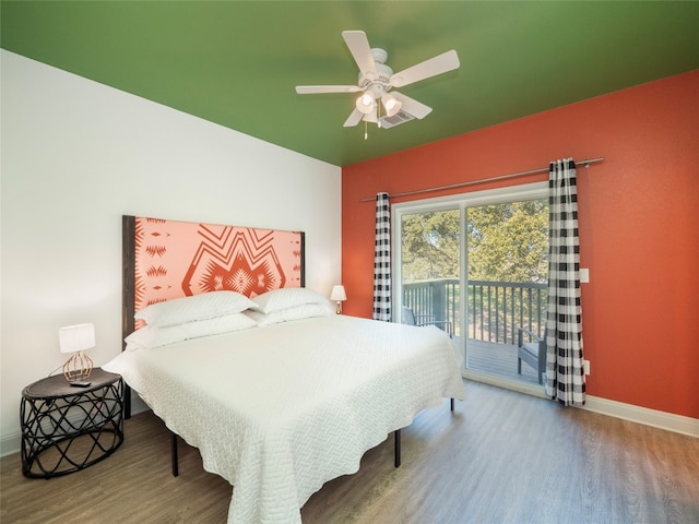 bedroom featuring access to outside, ceiling fan, and hardwood / wood-style floors