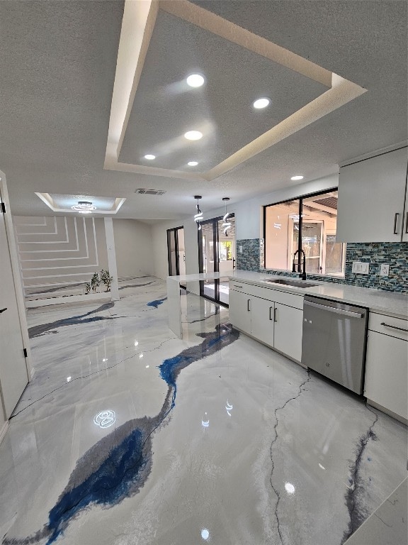 kitchen with white cabinets and a wealth of natural light