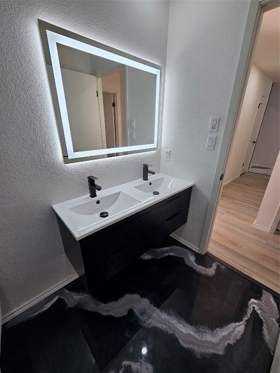 bathroom featuring vanity and hardwood / wood-style flooring