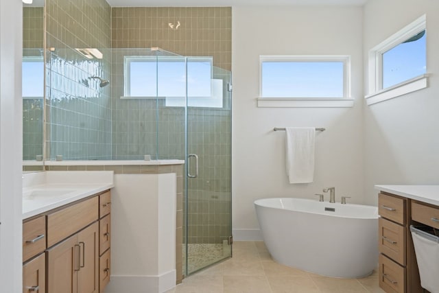 301 Miranda Way, Georgetown, TX 78633 - full bath with vanity, a shower stall, a freestanding tub, and tile patterned flooring