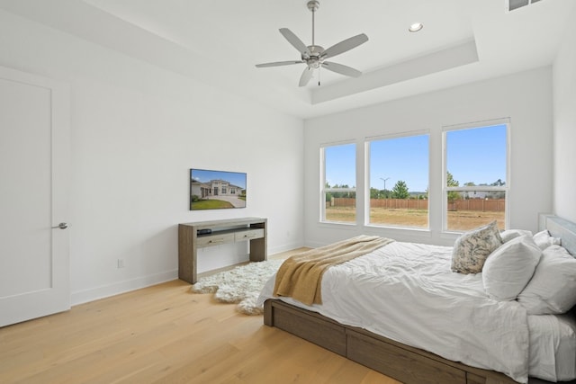 301 Miranda Way, Georgetown, TX 78633 - bedroom featuring light wood-style flooring, recessed lighting, a raised ceiling, and ceiling fan