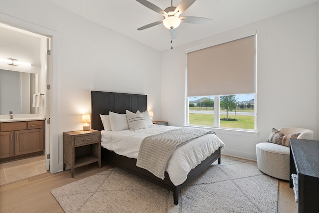 301 Miranda Way, Georgetown, TX 78633 - bedroom featuring light wood-type flooring, ensuite bathroom, and ceiling fan