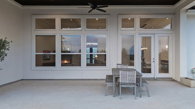 view of patio featuring ceiling fan