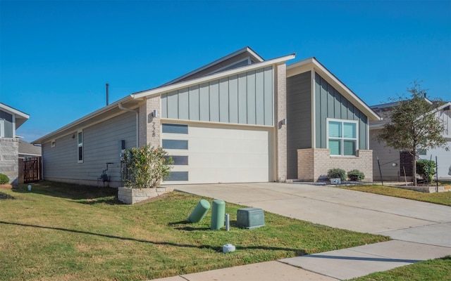 view of front of home with a garage and a front yard