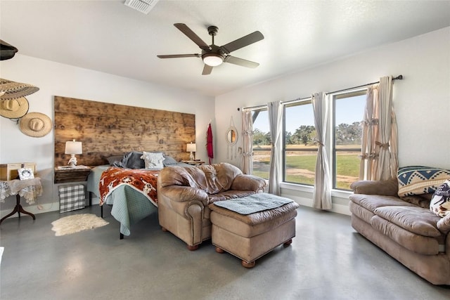 bedroom featuring concrete floors, visible vents, and ceiling fan