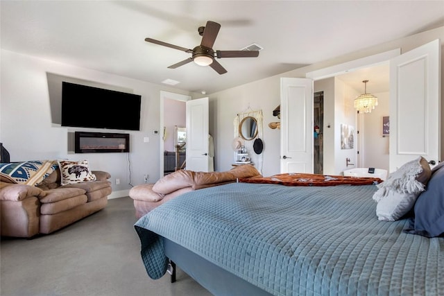 carpeted bedroom featuring ceiling fan with notable chandelier and visible vents