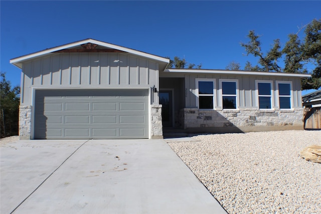 single story home featuring a garage